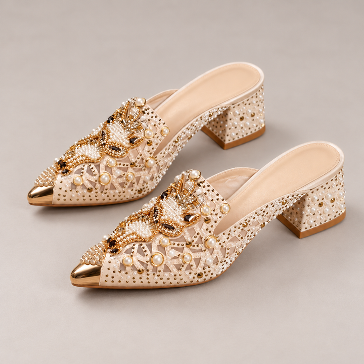 Pair of Khaki Odette mules with pearl-accented uppers, gold-tone pointed toes and embellished block heels.