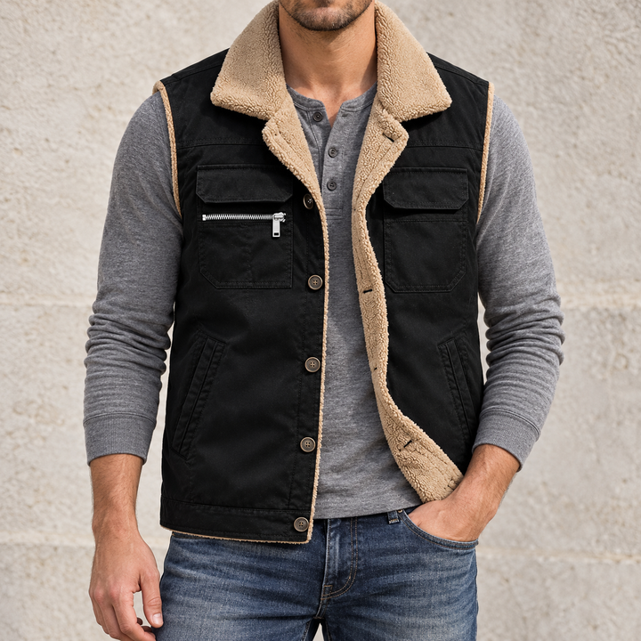 Black plush-lined utility vest shown from the front on a model