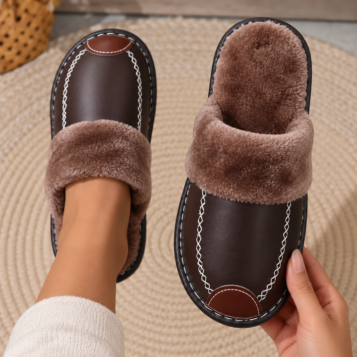 Top-down view of Dark Brown Alder slippers worn and held