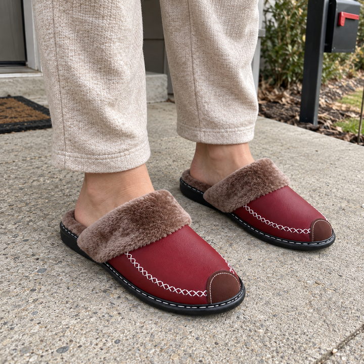 Burgundy Alder slippers worn on a dry porch