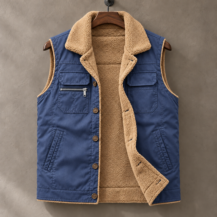 Blue Hudson plush-lined vest on a wooden hanger, open to reveal tan lining