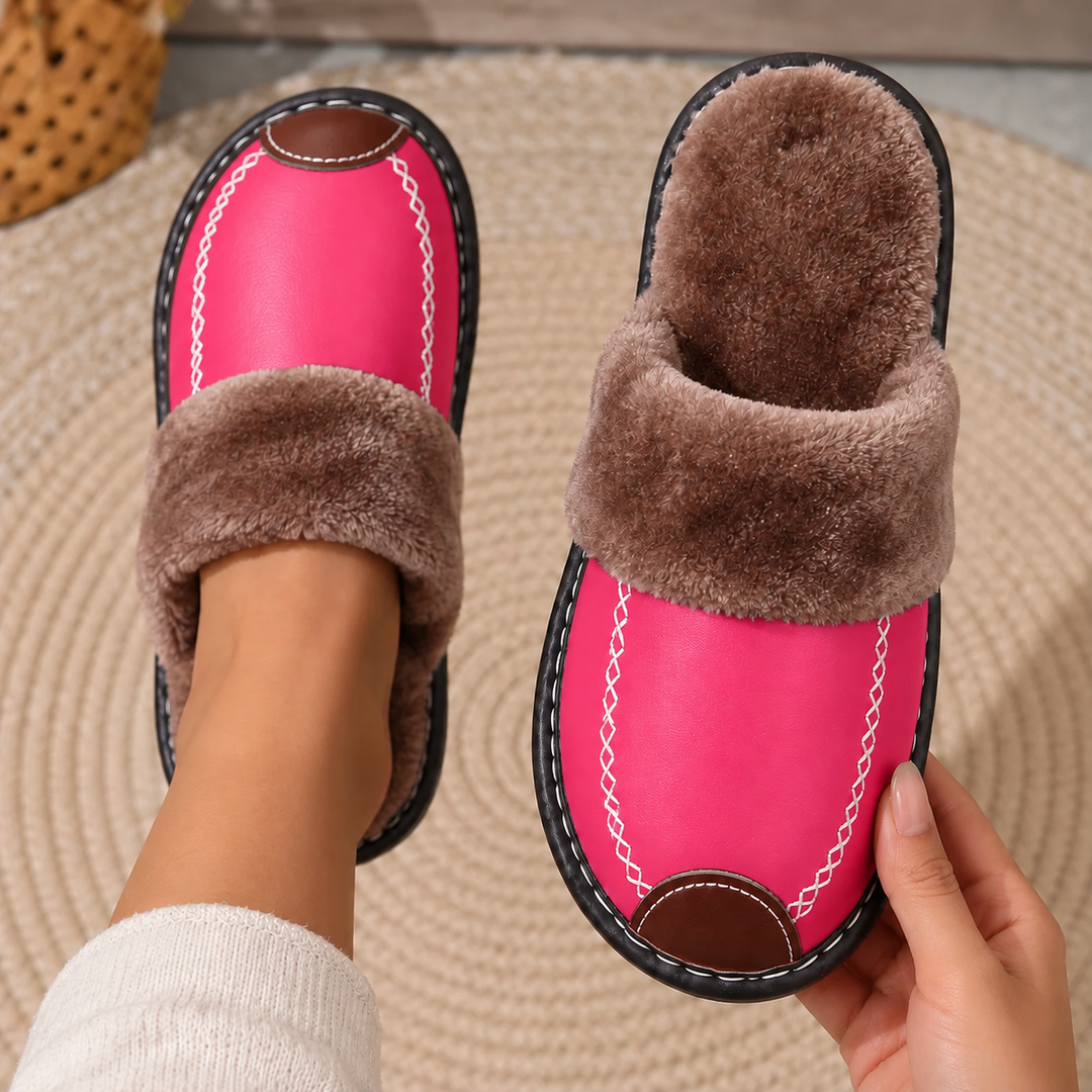Laurel Fur-Lined Slippers in Pink, worn and held above a woven rug