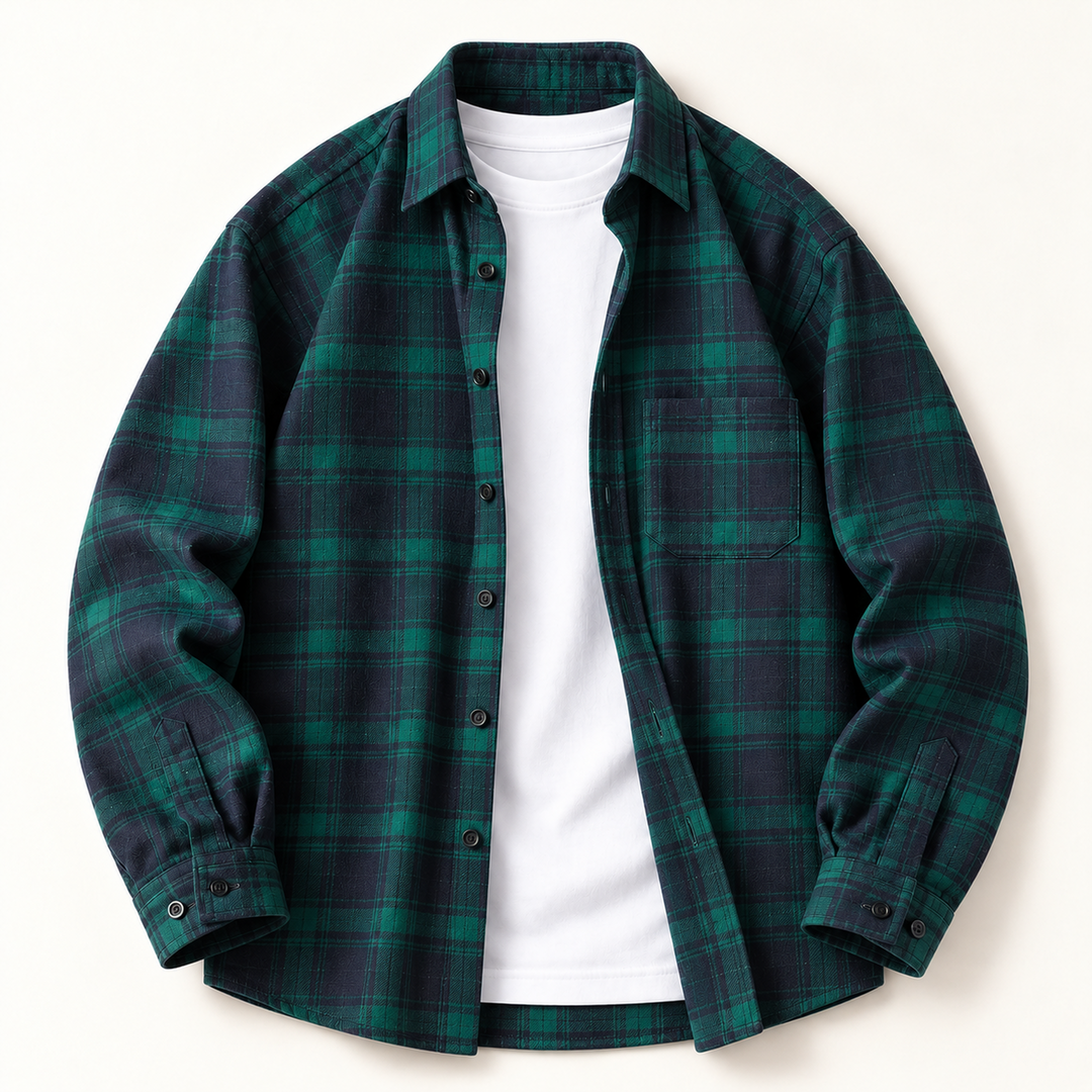 Open-front green and navy plaid flannel shirt styled over a white T-shirt.